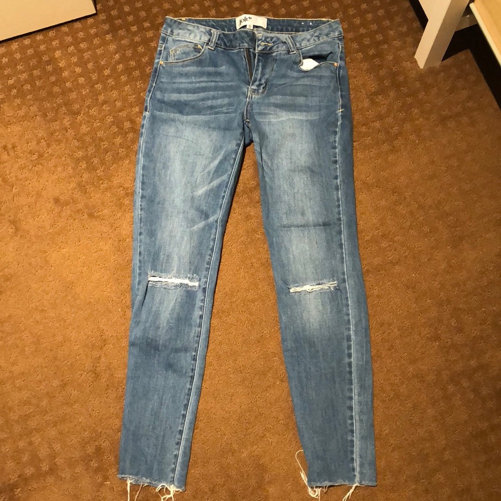 Jolt jeans with rips in knees and frayed bottom